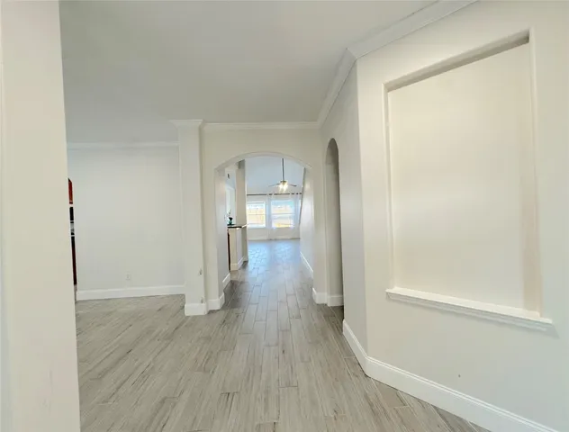a view of a room with wooden floor