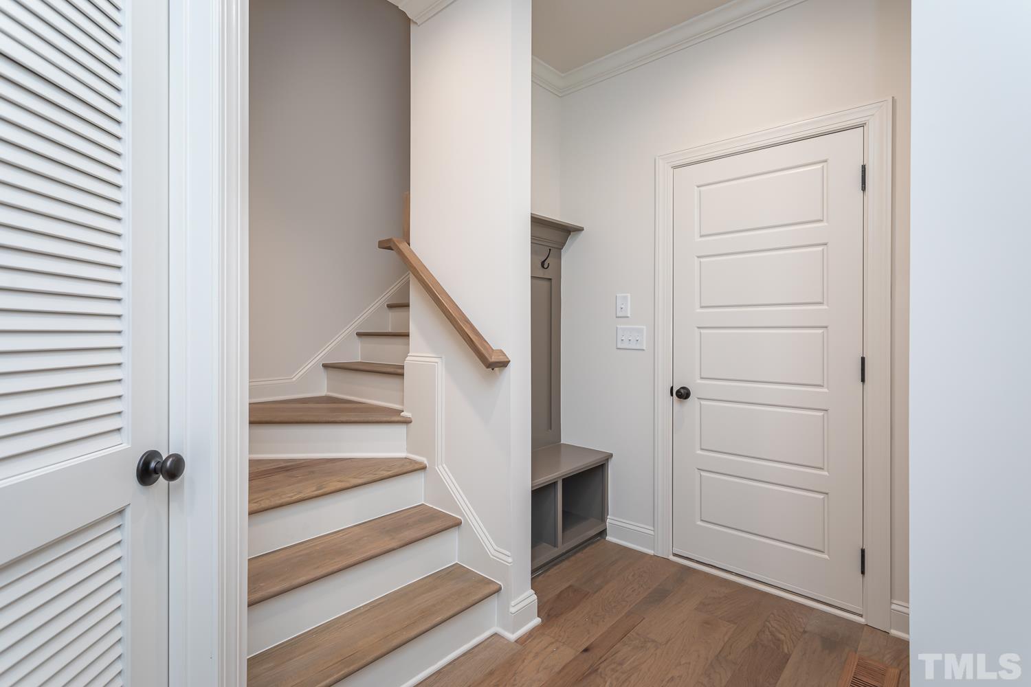 76 Bucchero Lane Clayton, NC 27527 - Photo 20 of 41 a view of a hallway with wooden floor and entryway