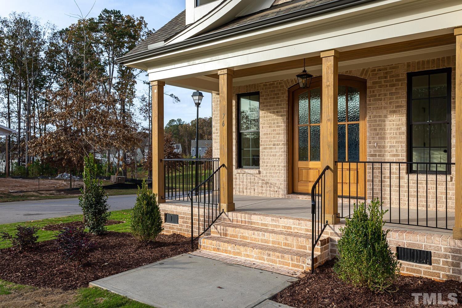 76 Bucchero Lane Clayton, NC 27527 - Photo 3 of 41 a view of a house with a garden