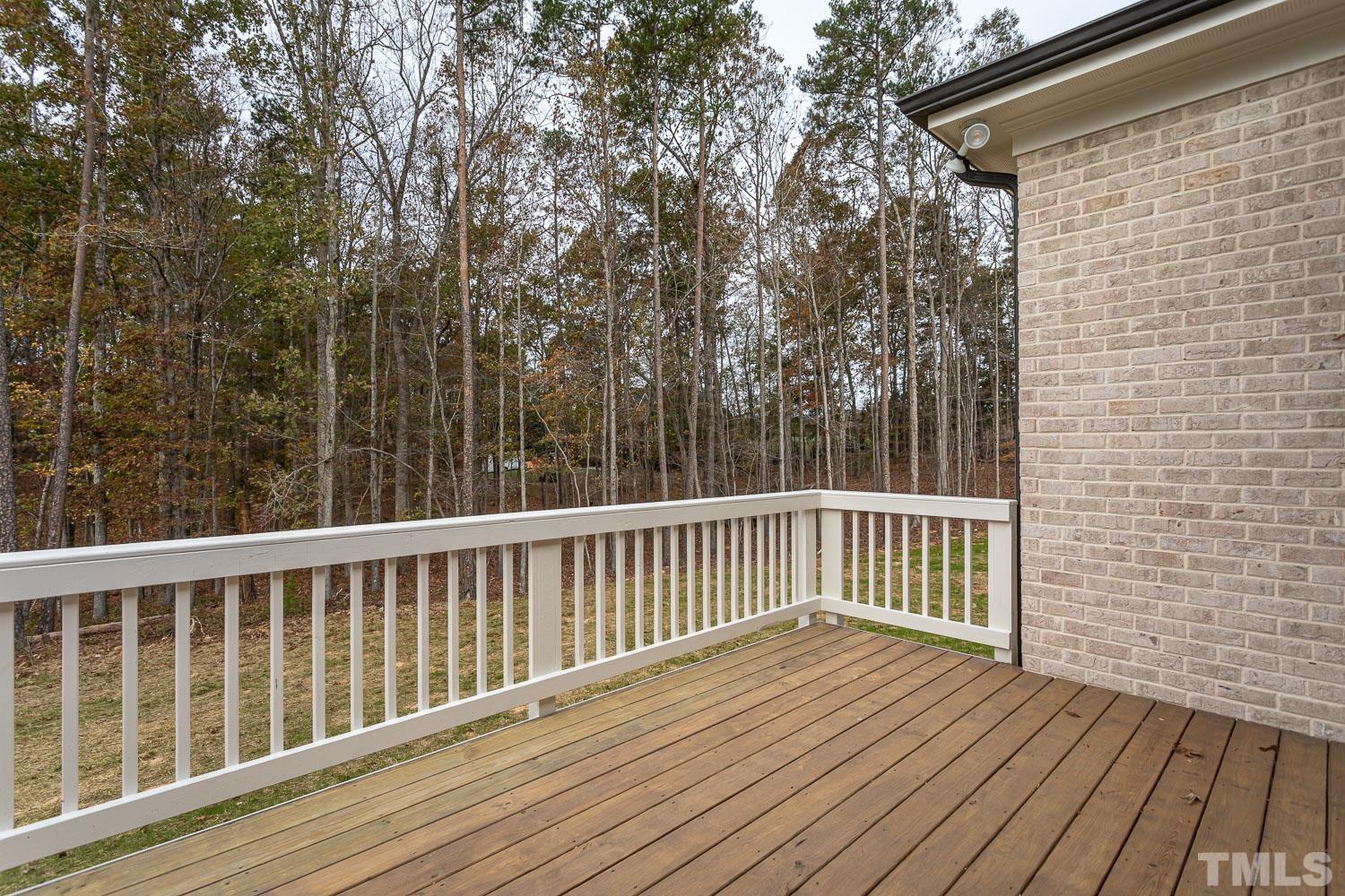 76 Bucchero Lane Clayton, NC 27527 - Photo 33 of 41 a view of deck with wooden floor and fence