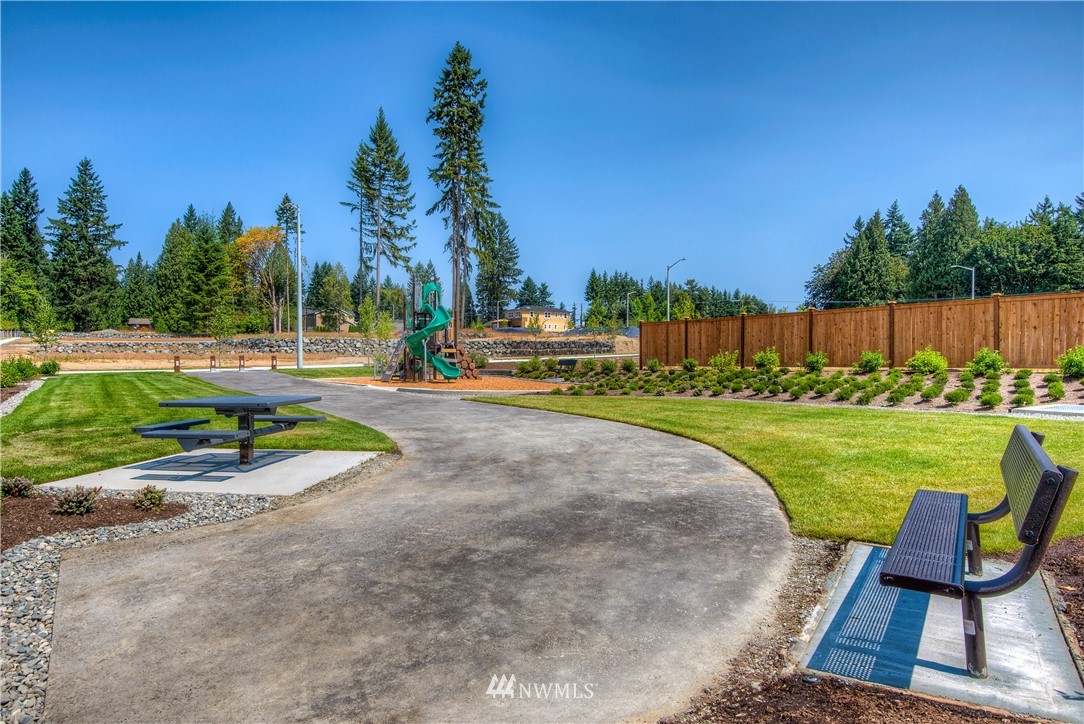21811 33rd Drive Southeast, Unit 28 Bothell, WA 98021 - Photo 22 of 25 a view of a park with swings and slides