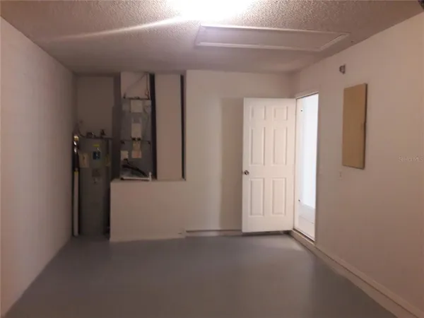 a view of an empty room with glass door