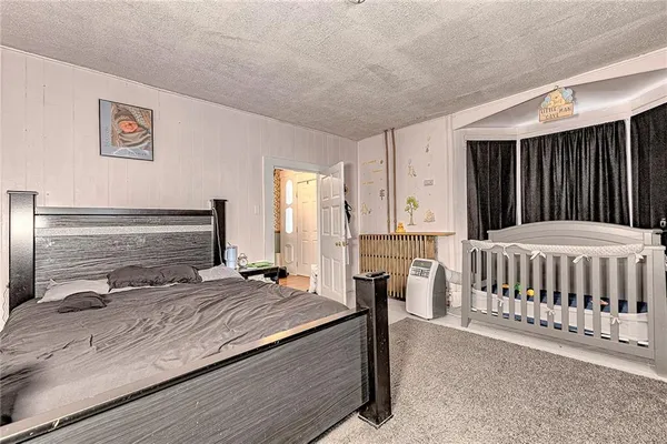 a view of a livingroom with workspace and a window