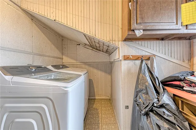 a bathroom with a shower and a sink
