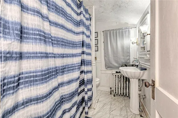 a bedroom with furniture and window