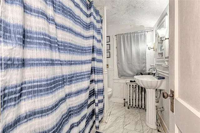 a bedroom with furniture and window