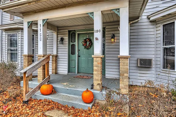 a view of a bathroom with wooden floor and mirror