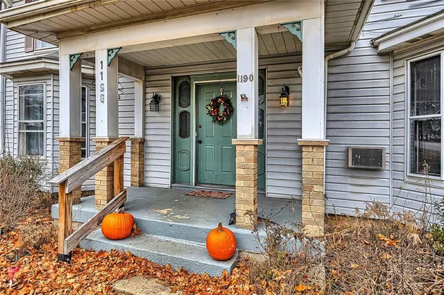 a view of a bathroom with wooden floor and mirror