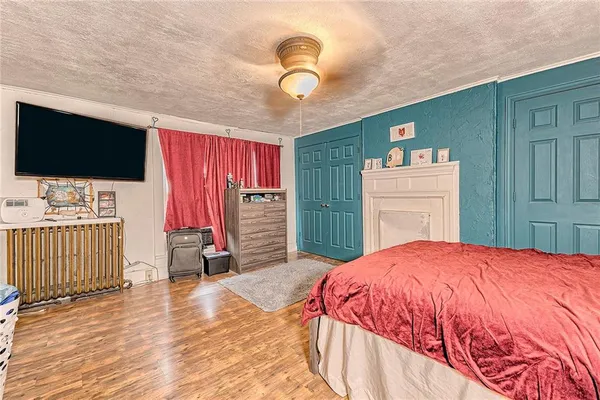 a bed room with a bed furniture and a chandelier