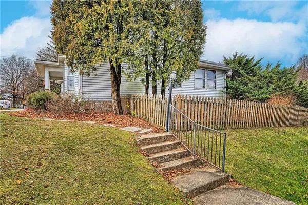 a balcony with table and chairs