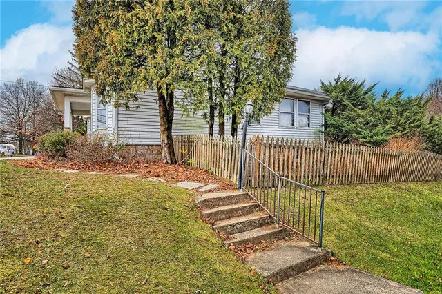a balcony with table and chairs