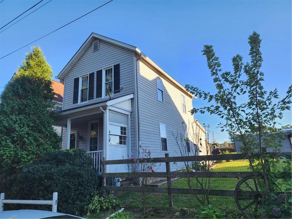 709 North 7th Street Apollo, PA 15613 - Photo 1 of 50 a front view of a house with garden