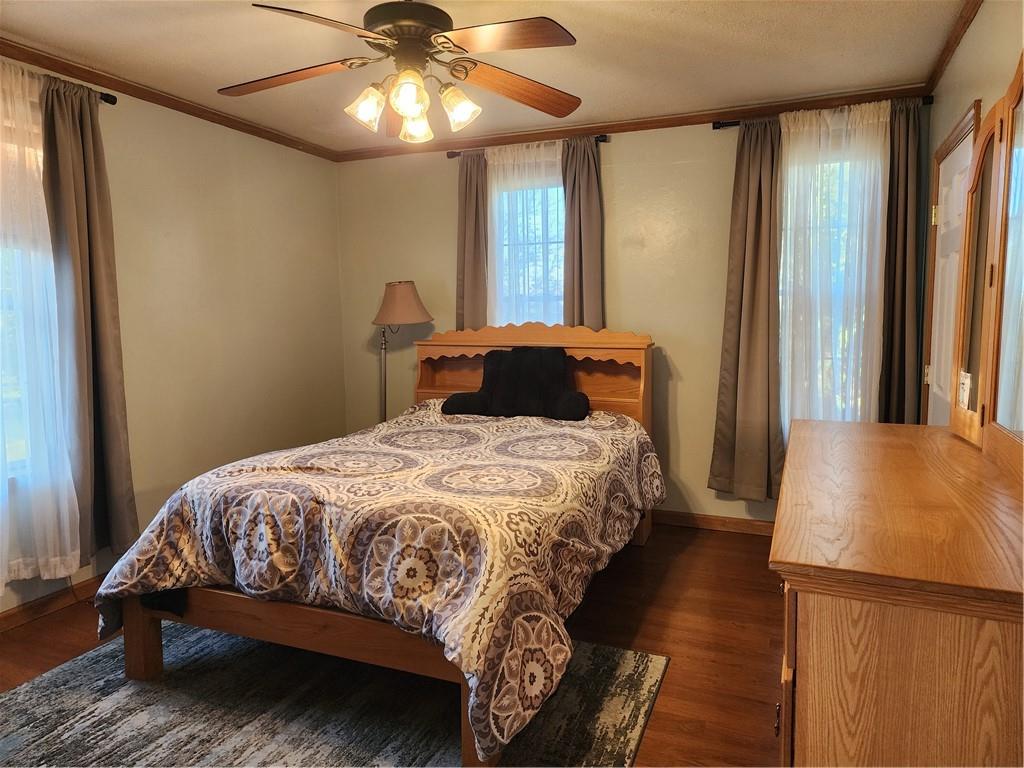 709 North 7th Street Apollo, PA 15613 - Photo 25 of 50 a bedroom with a bed and a chandelier