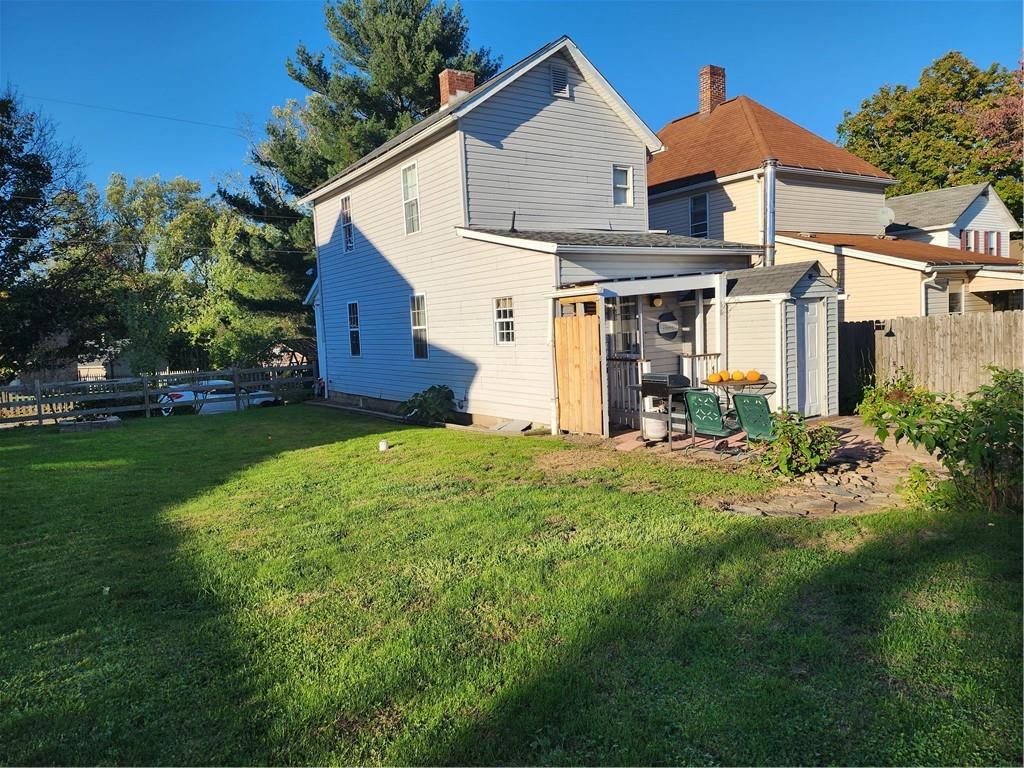 709 North 7th Street Apollo, PA 15613 - Photo 5 of 50 a view of a yard in front of a house with plants and large tree