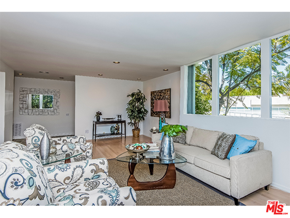 1437 North Tigertail Road Los Angeles, CA 90049 - Photo 2 of 31 a living room with furniture and a large window