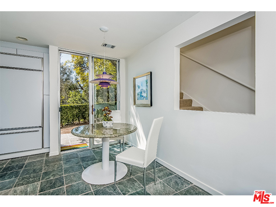 1437 North Tigertail Road Los Angeles, CA 90049 - Photo 12 of 31 a view of a dining room with furniture window and wooden floor