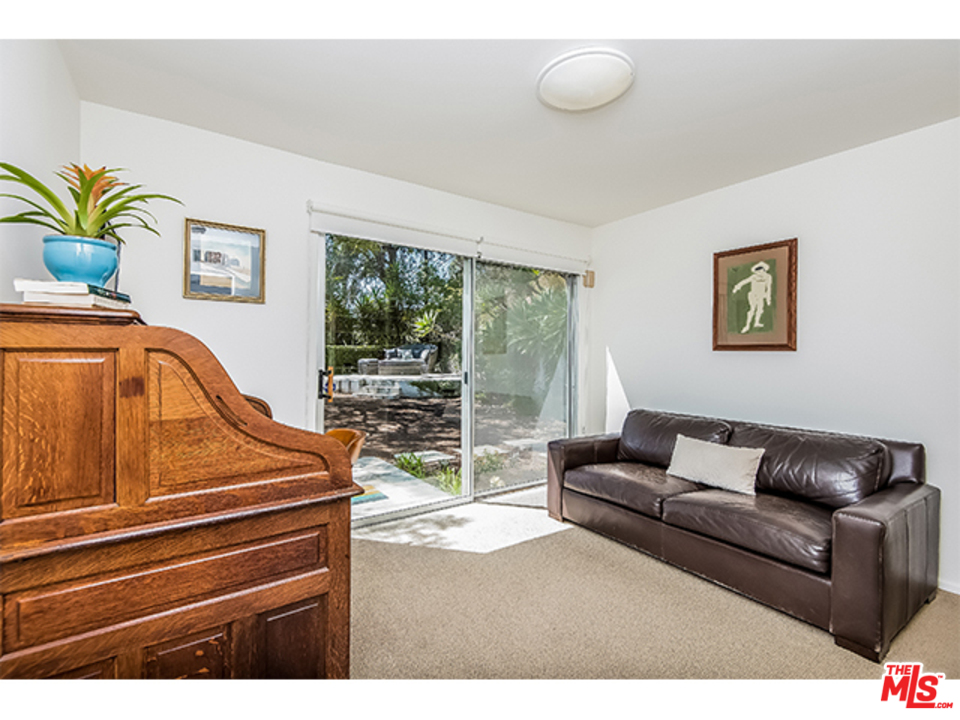 1437 North Tigertail Road Los Angeles, CA 90049 - Photo 13 of 31 a living room with furniture and a potted plant