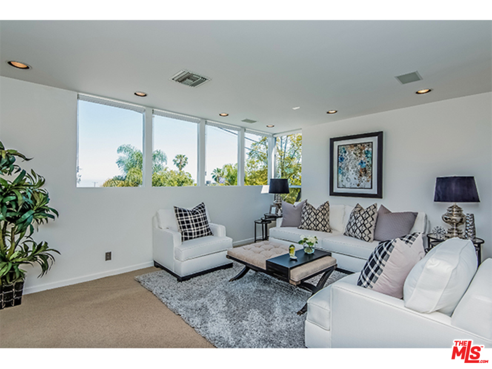 1437 North Tigertail Road Los Angeles, CA 90049 - Photo 15 of 31 a living room with furniture and a large window