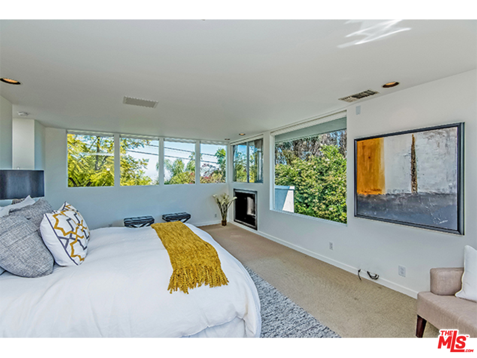 1437 North Tigertail Road Los Angeles, CA 90049 - Photo 23 of 31 a view of furniture and floor to ceiling window in an empty room