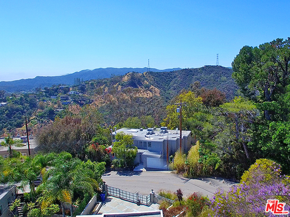 1437 North Tigertail Road Los Angeles, CA 90049 - Photo 30 of 31 an aerial view of a house and mountain view