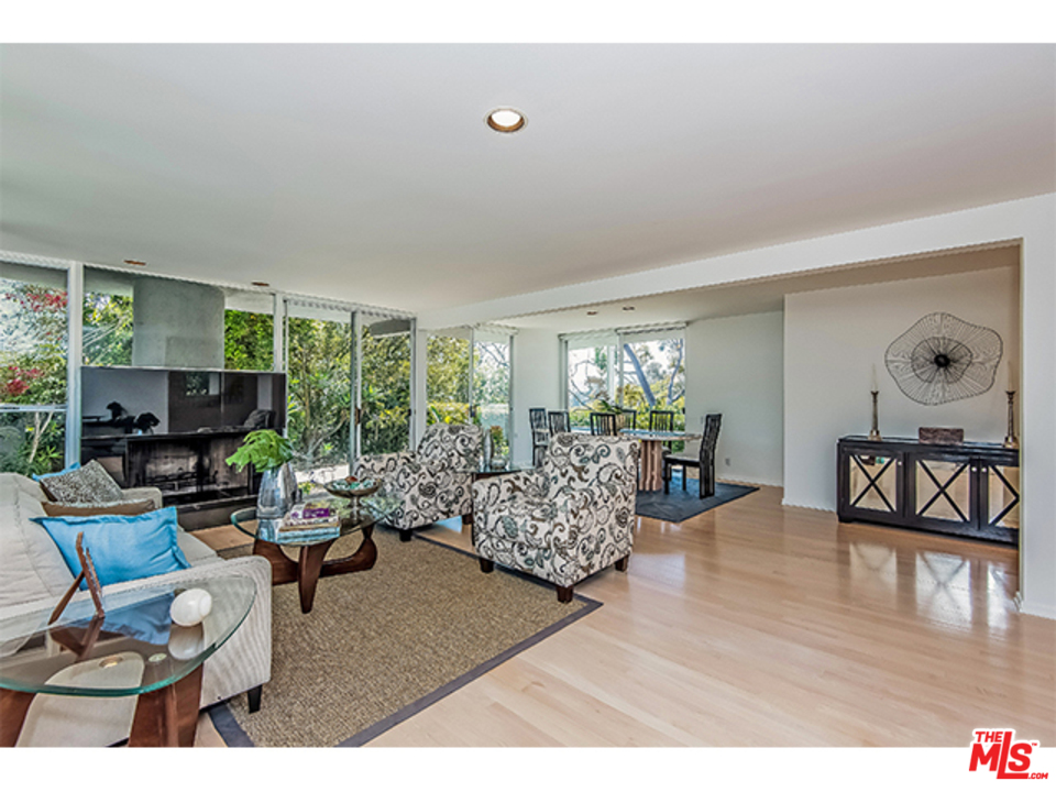 1437 North Tigertail Road Los Angeles, CA 90049 - Photo 4 of 31 a living room with furniture and a flat screen tv