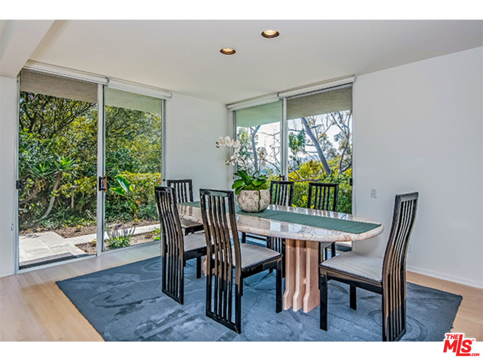 1437 North Tigertail Road Los Angeles, CA 90049 - Photo 5 of 31 a view of a dining room with furniture window and wooden floor