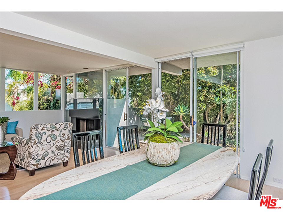 1437 North Tigertail Road Los Angeles, CA 90049 - Photo 7 of 31 a living room filled with furniture and a potted plant