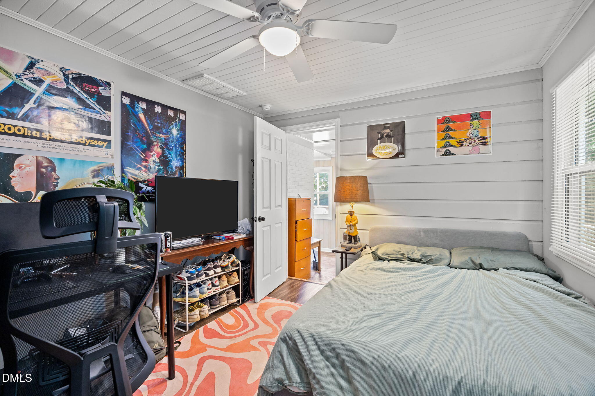 3418 Avent Ferry Road Raleigh, NC 27606 - Photo 9 of 25 a bedroom with a bed and a flat screen tv