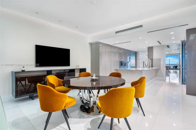 a outdoor living space with furniture and a flat screen tv