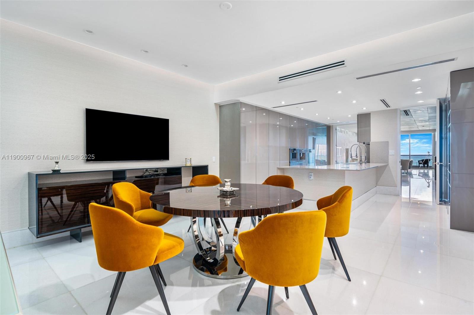 9349 Collins Avenue, Unit 503 Surfside, FL 33154 - Photo 11 of 30 a outdoor living space with furniture and a flat screen tv