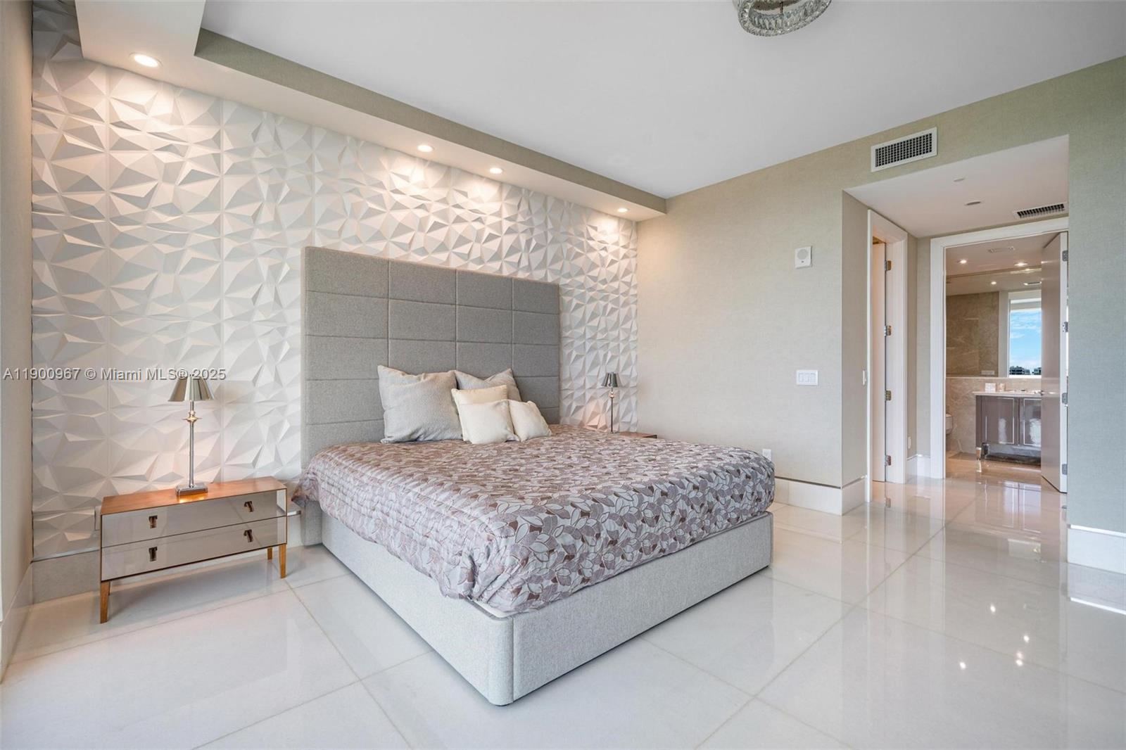 9349 Collins Avenue, Unit 503 Surfside, FL 33154 - Photo 19 of 30 a bedroom with a bed and a view of bathroom