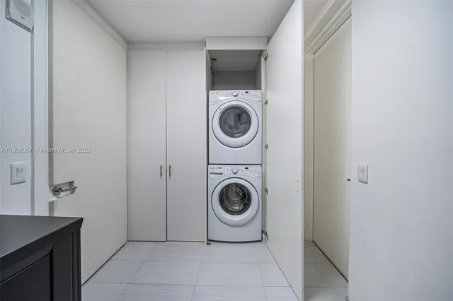 a utility room with sink dryer and washer