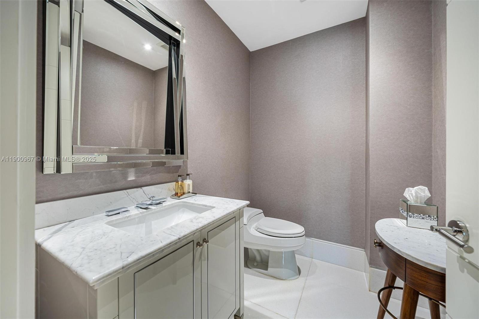 9349 Collins Avenue, Unit 503 Surfside, FL 33154 - Photo 7 of 30 a bathroom with a sink toilet and mirror