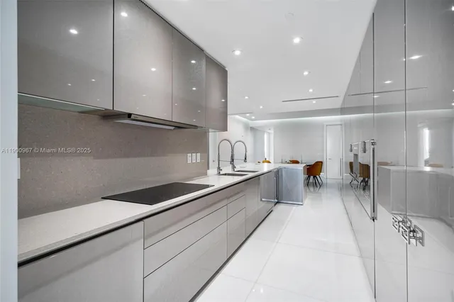 a kitchen with counter top space cabinets and stainless steel appliances