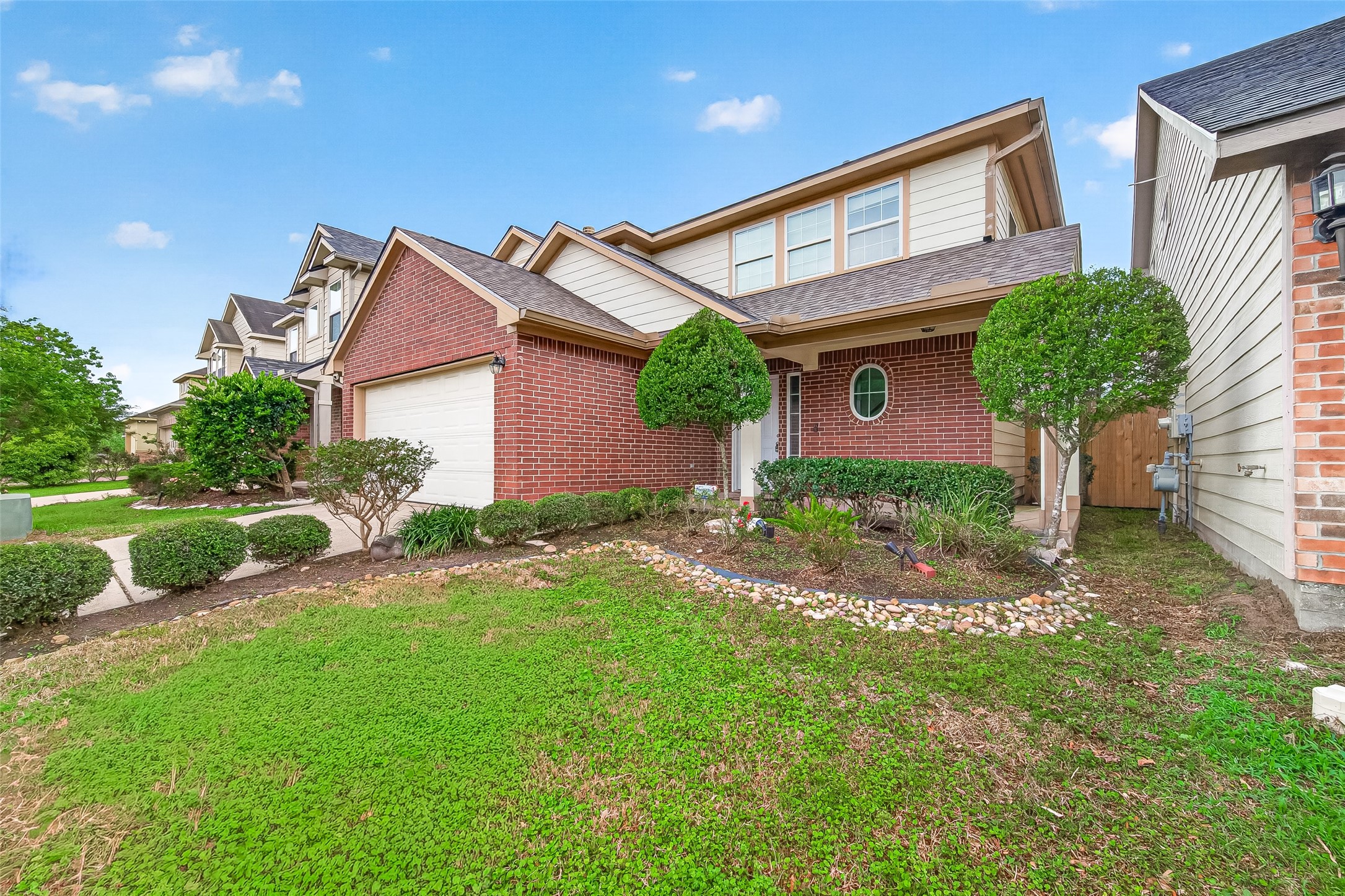 2415 Lacyberry Street Houston, TX 77080 - Photo 2 of 50 a front view of a house with garden