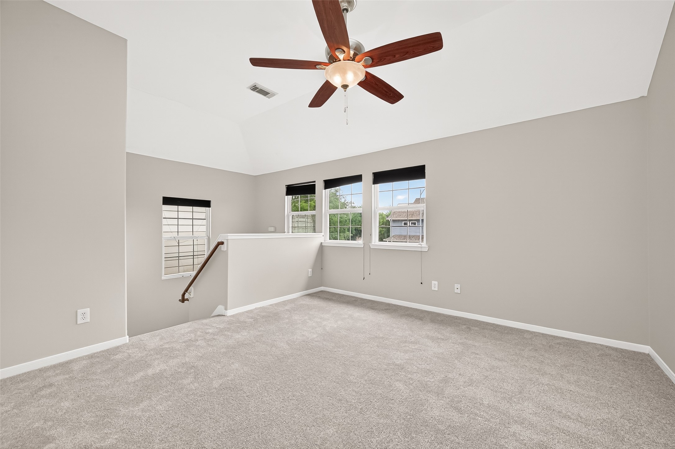 2415 Lacyberry Street Houston, TX 77080 - Photo 25 of 50 an empty room with ceiling fan and windows