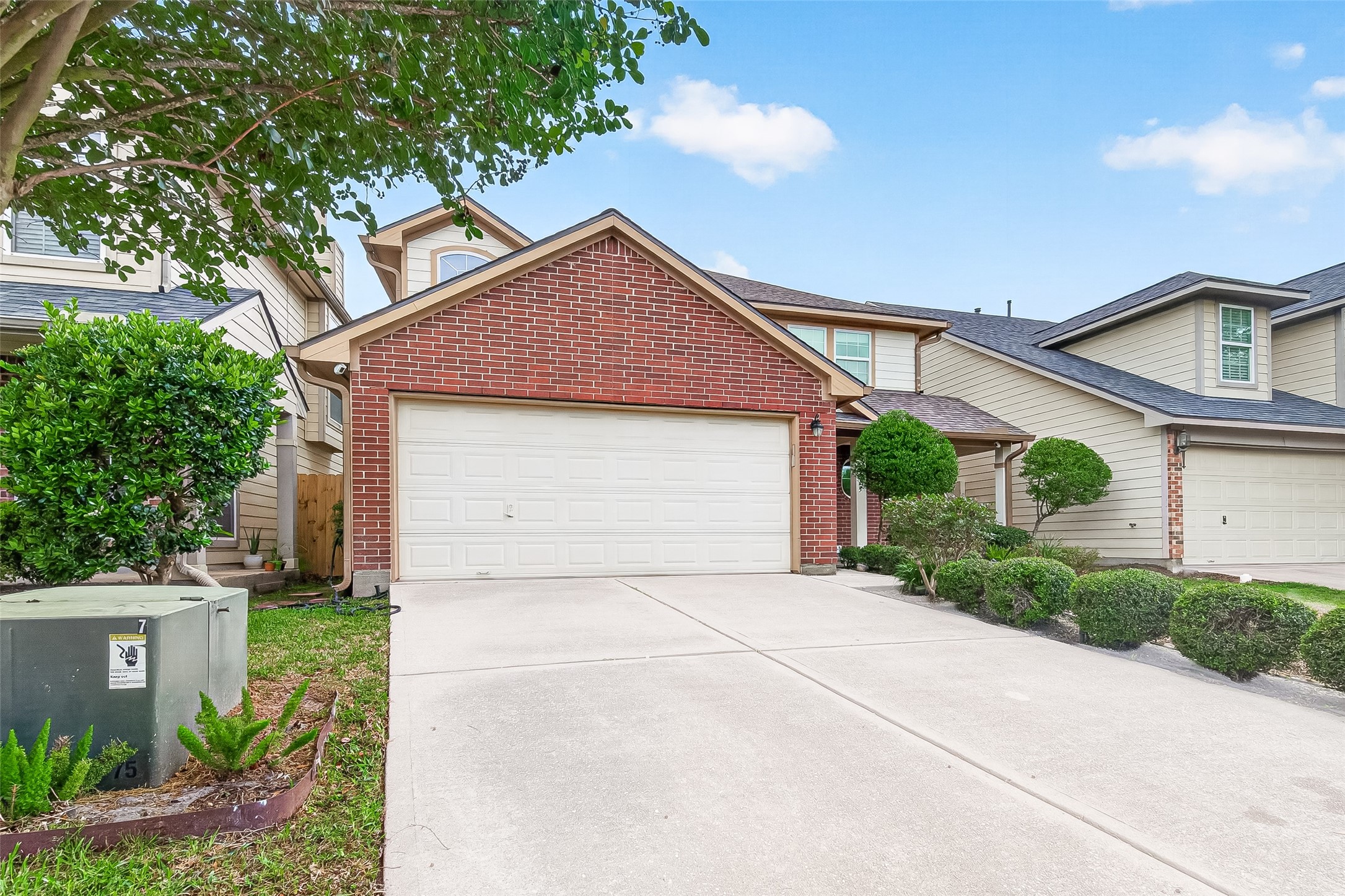 2415 Lacyberry Street Houston, TX 77080 - Photo 3 of 50 a front view of a house with a yard and garage