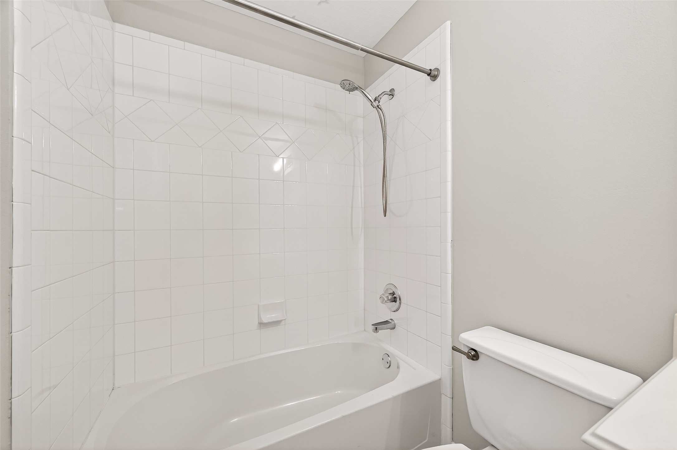 2415 Lacyberry Street Houston, TX 77080 - Photo 34 of 50 a bathroom with a toilet and a bathtub