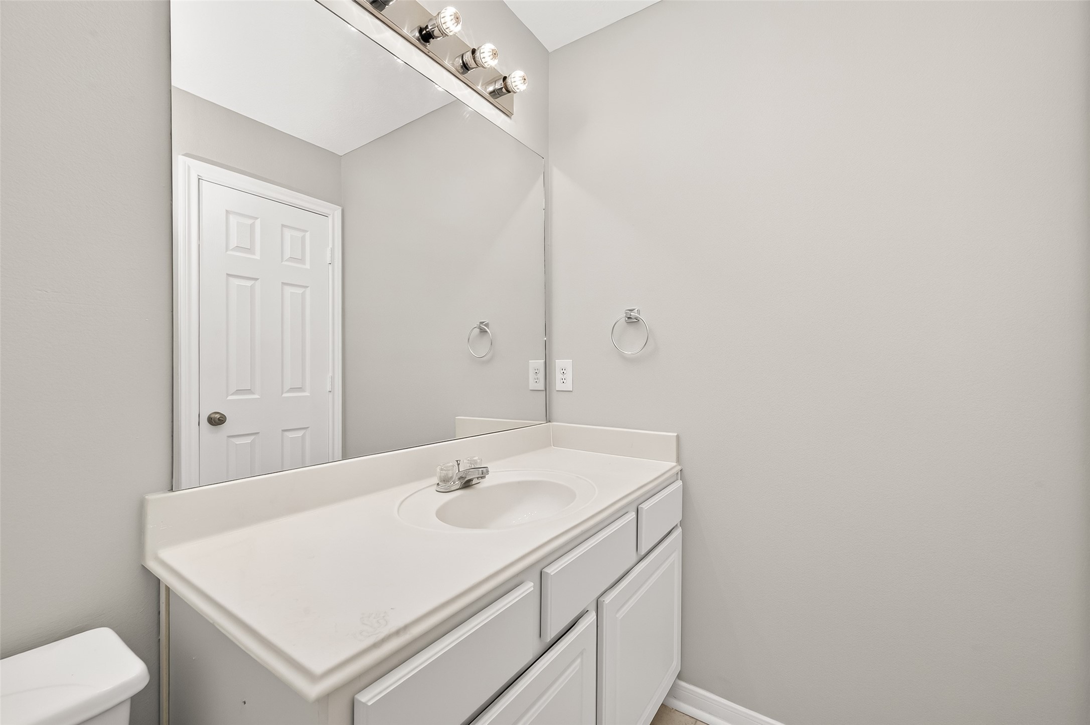 2415 Lacyberry Street Houston, TX 77080 - Photo 35 of 50 a bathroom with a sink a toilet and a mirror