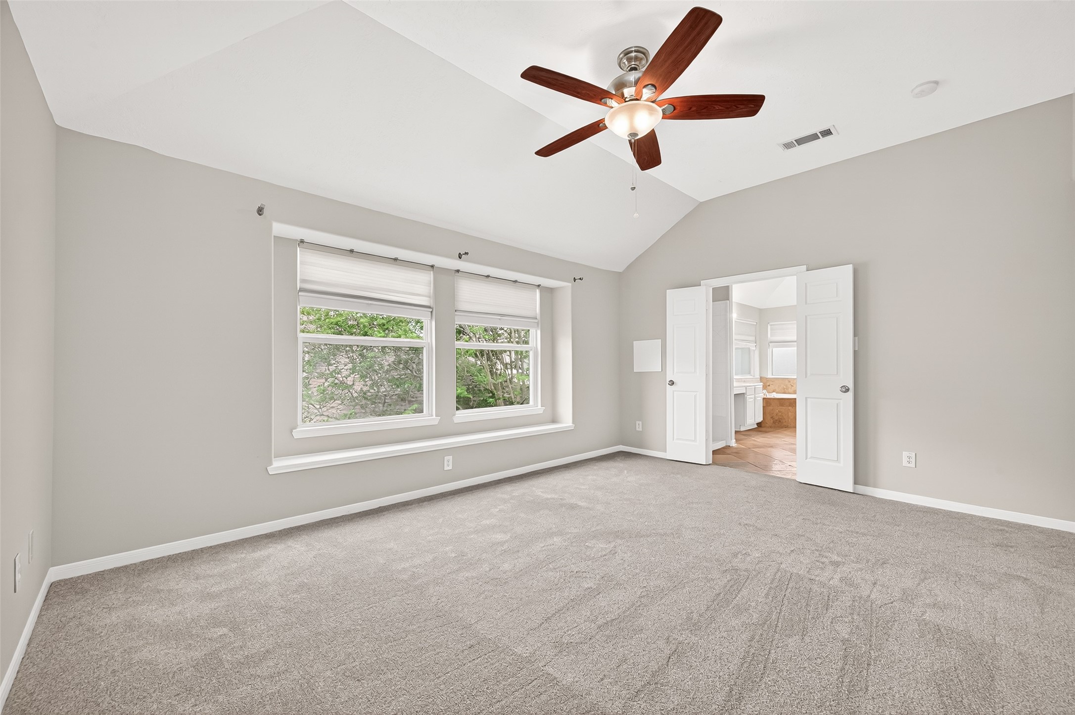 2415 Lacyberry Street Houston, TX 77080 - Photo 40 of 50 a view of a livingroom with a ceiling fan and window
