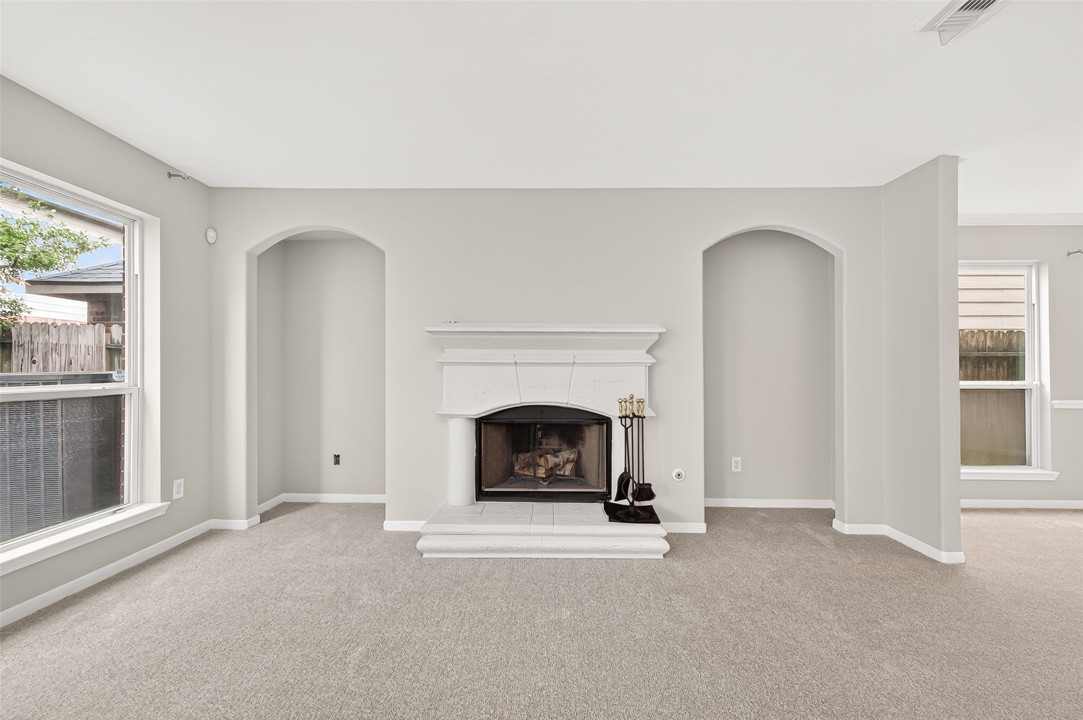 2415 Lacyberry Street Houston, TX 77080 - Photo 9 of 50 a living room with a fireplace and a window