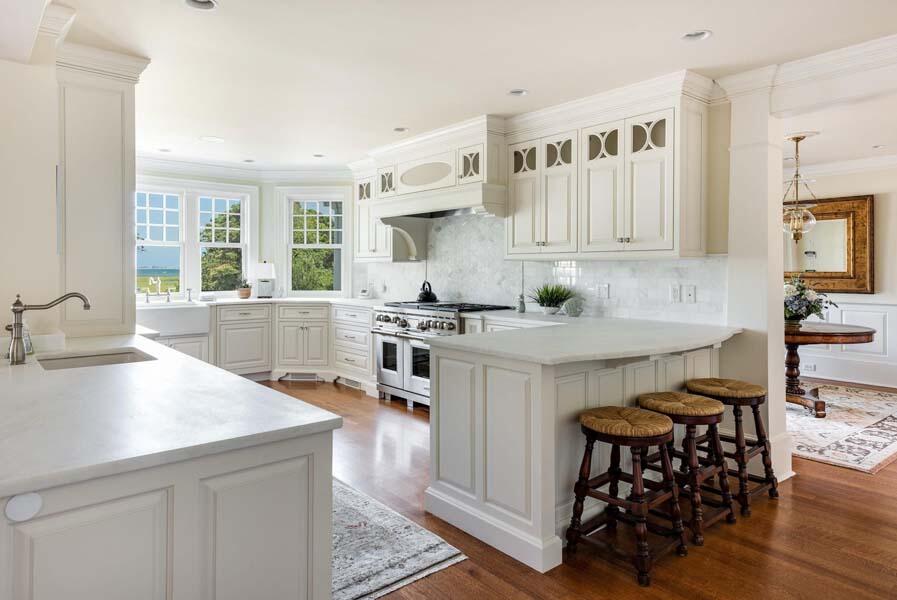 56 Rendezvous Lane Barnstable, MA 02630 - Photo 11 of 38 a kitchen with granite countertop a sink and a stove top oven