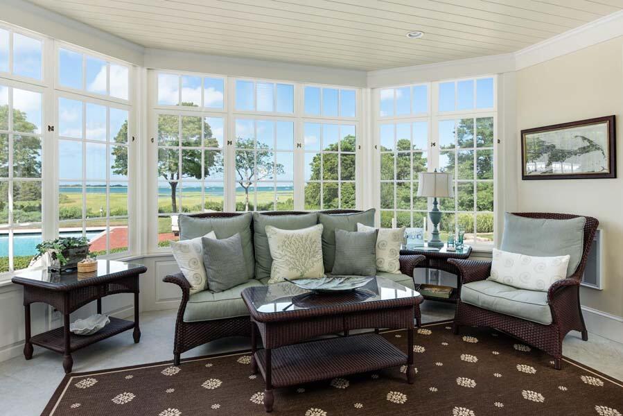 56 Rendezvous Lane Barnstable, MA 02630 - Photo 12 of 38 a living room with furniture and a floor to ceiling window