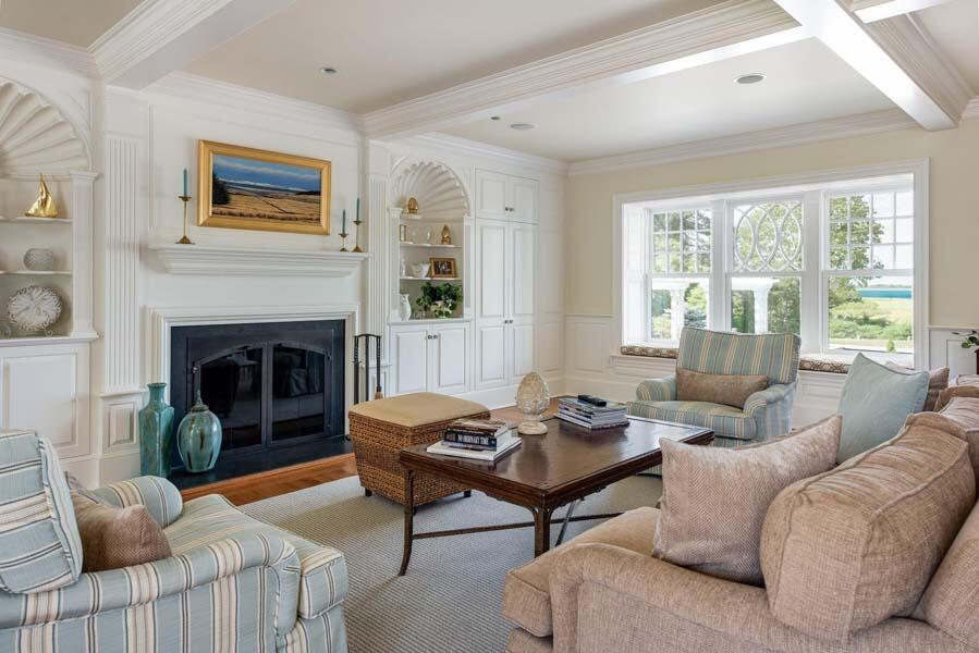 56 Rendezvous Lane Barnstable, MA 02630 - Photo 14 of 38 a living room with furniture a large window and a fireplace