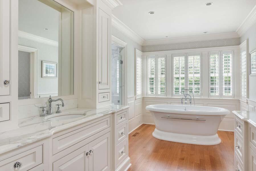 56 Rendezvous Lane Barnstable, MA 02630 - Photo 31 of 38 a spacious bathroom with sink a mirror a bathtub and next to a window