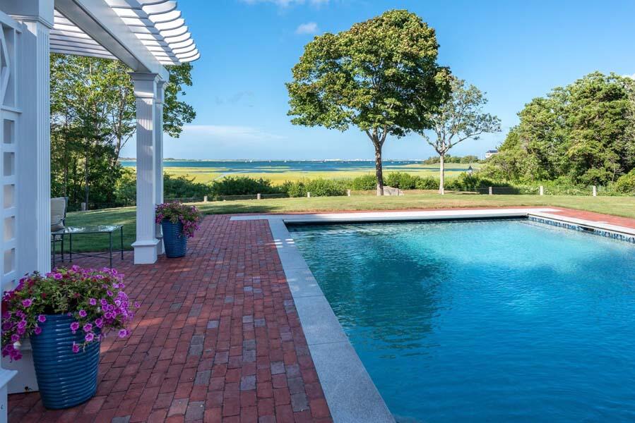 56 Rendezvous Lane Barnstable, MA 02630 - Photo 7 of 38 a view of a swimming pool with a yard