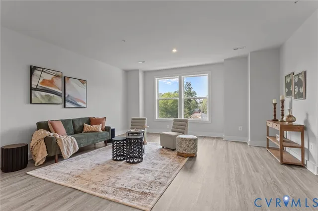 a living room with furniture and a table