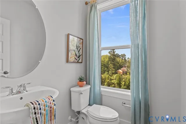 a bathroom with a sink a toilet and tub