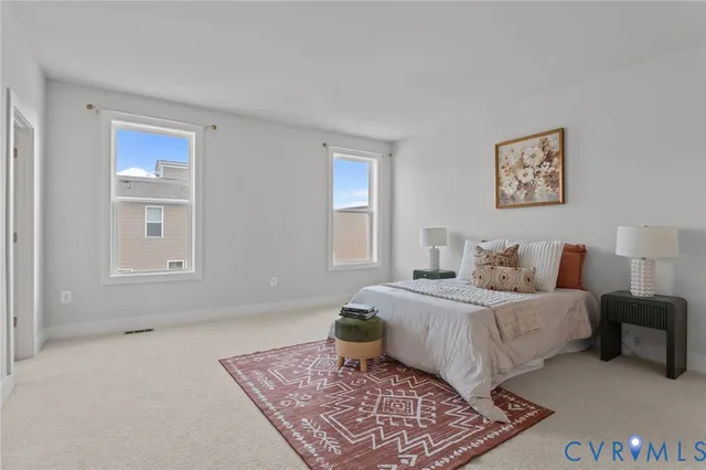 a bedroom with a bed and a table in it