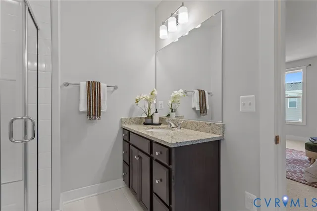 a couple of potted plants in front of door